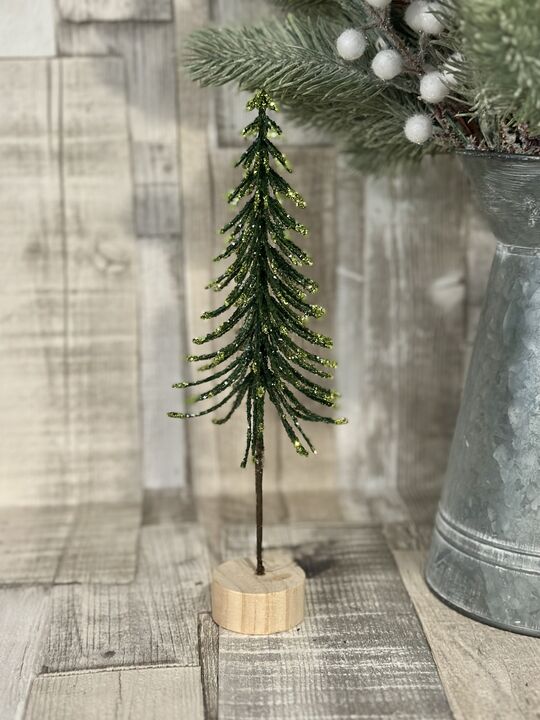 Green Slim Glittered Tree On Log Slice 